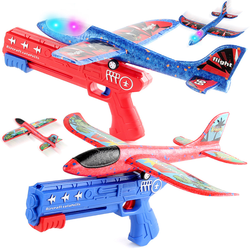 Lanzamiento de un clic espuma emisora de luz Catapulta Aeronave pistola lanzadora de mano planeador juguetes al aire libre para niños puesto de mercado nocturno Juguetes