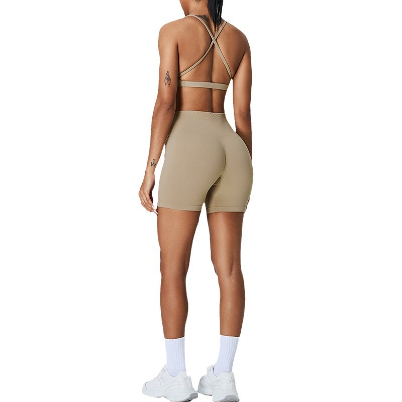 Nuevo traje de yoga sin costuras europeo y americano, pantalones cortos de yoga de cadera de melocotón para mujer, traje deportivo de carrera de espalda cruzada