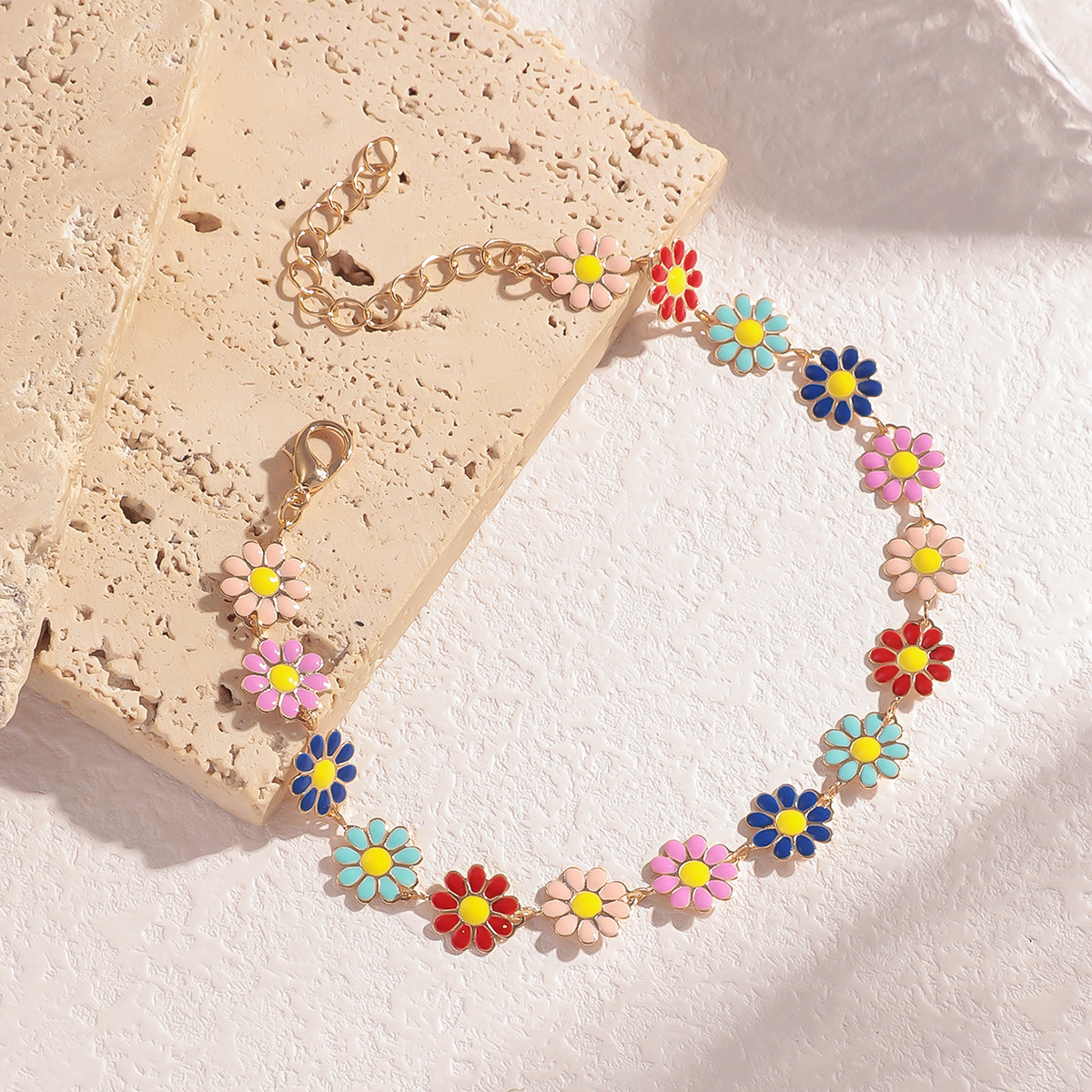 Fábrica directa de estilo bohemio personalidad goteo de flores de bronce pie adornamiento mujer simple versátil margarita correa de pie