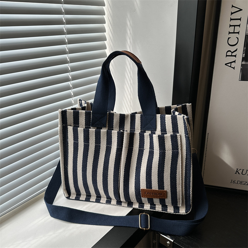 Bolsas de gran capacidad de transporte 2024 nuevas bolsas de mujer populares bolsas de lona a rayas bolsas de mochilas de moda bolsas de mano