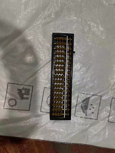 A 17-digit abacus with a clearing device