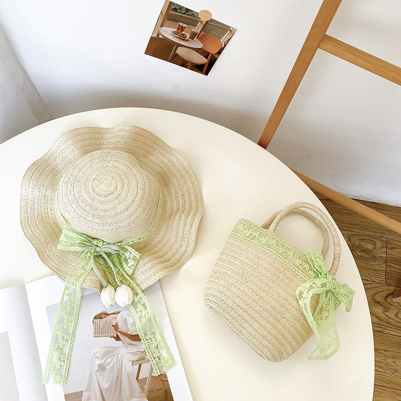 Nicho popular estilo coreano tulipán arco de papilla para niñas sombrero de paja paquete de bolsas pequeñas frescas dulces gorras de protección solar