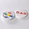 Five chess pieces with small white round box