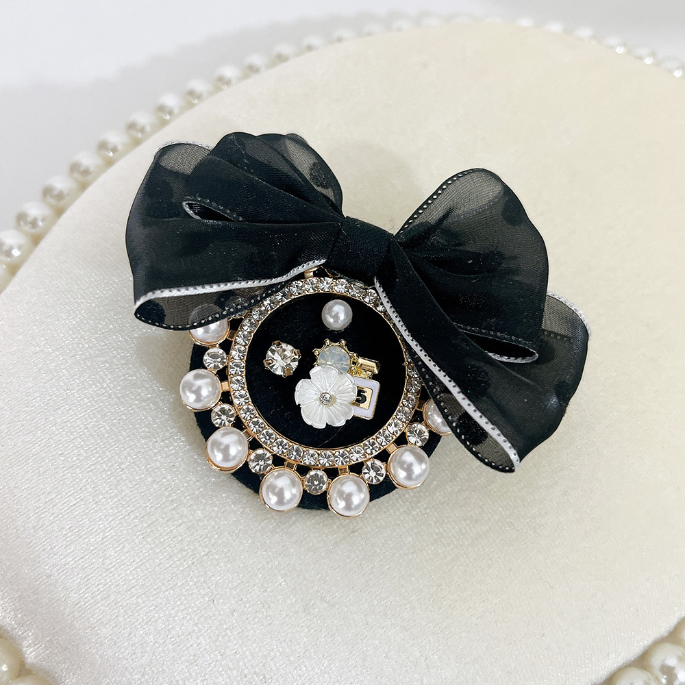 Spilla a fiocco con perle elegante accessorio versatile_voghion.com