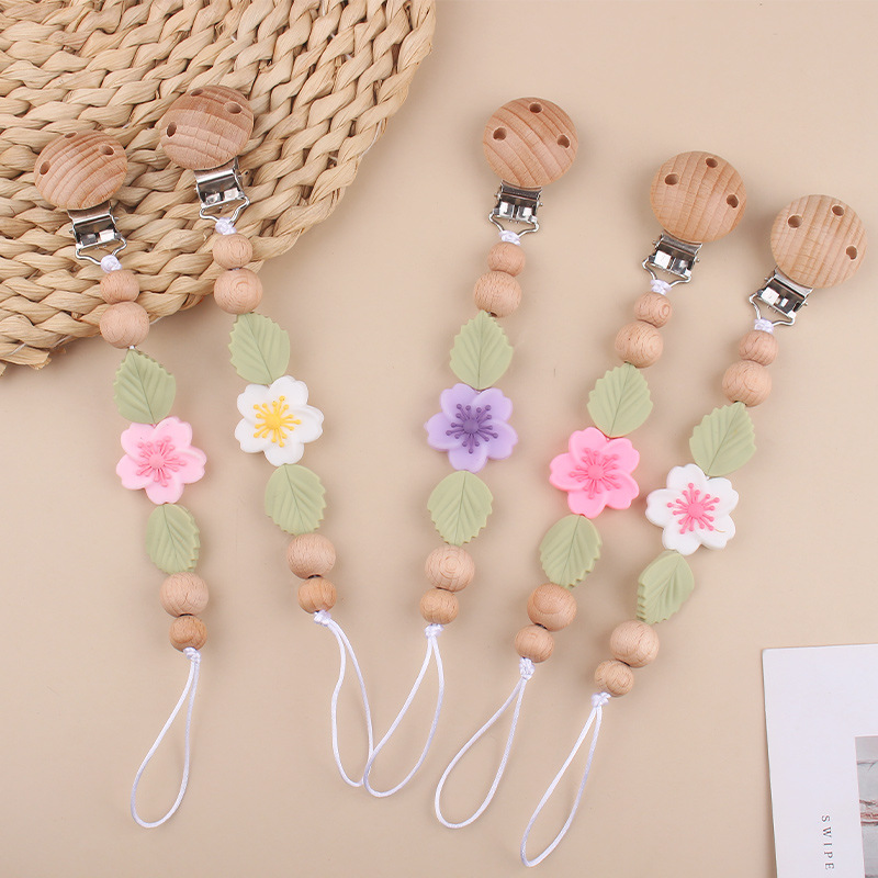 Nuevo clip de chupete de haya para bebés, dibujos animados creativos para bebés, flor de begonia, muerde los dientes, cadena de chupete anti-caída