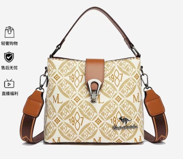 Bolso de cubo de sensación de alta gama para mujer 2025 verano nuevo bolso de hombro clásico de todo fósforo diseño de nicho bolso de mensajero portátil