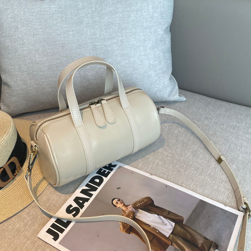 植なめしの上の牛革の枕の包みの女性の高級感の百合の小さい大衆のハンドバッグの女子学生のファッションのボストンバッグの女性