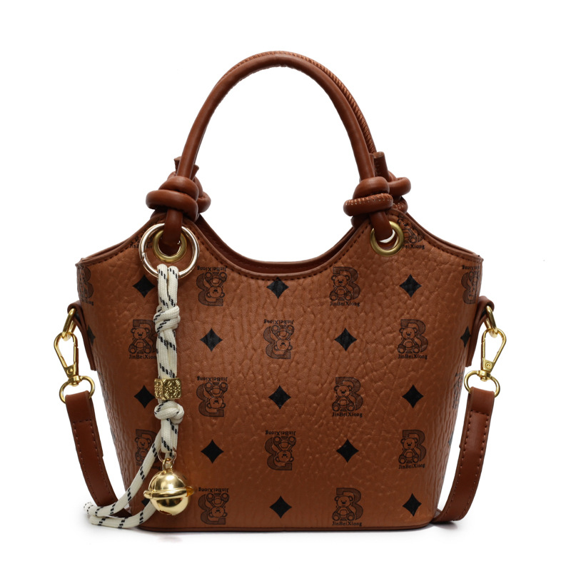 Tendencia impresa bolso de cubo de mano mujer 2025 nueva moda textura versátil bolso de hombro super caliente bolso de mochila