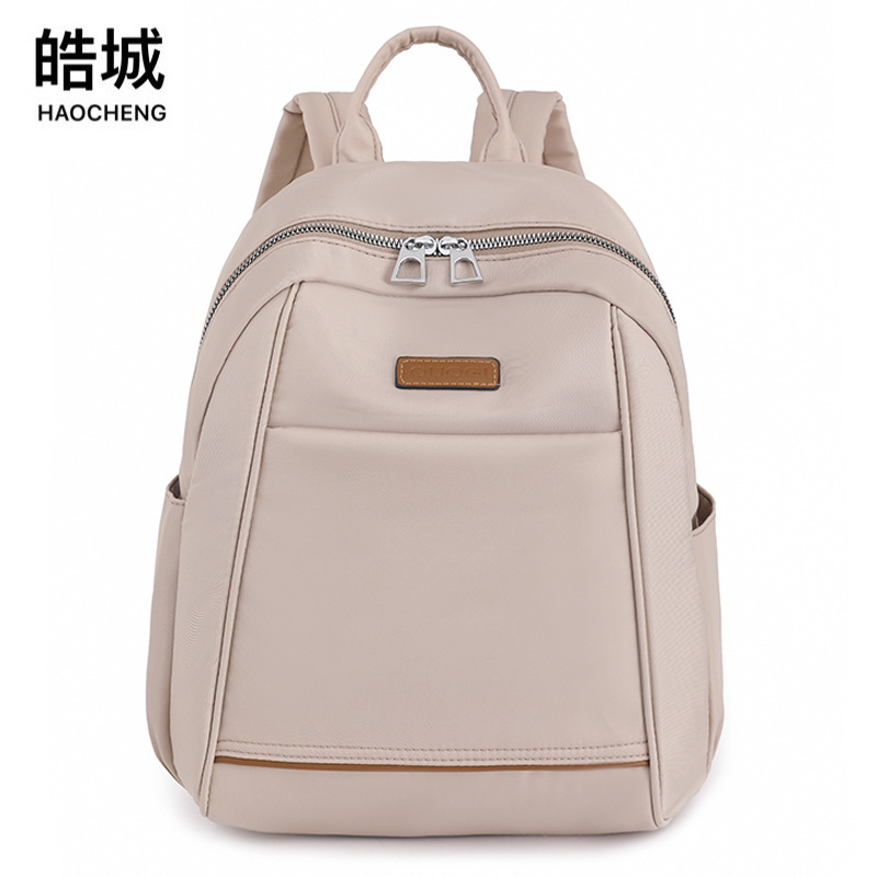 2023 nueva mochila de nailon casual para mujer, moda, literatura simple, viajes al aire libre, mochila pequeña, mochila escolar al por mayor