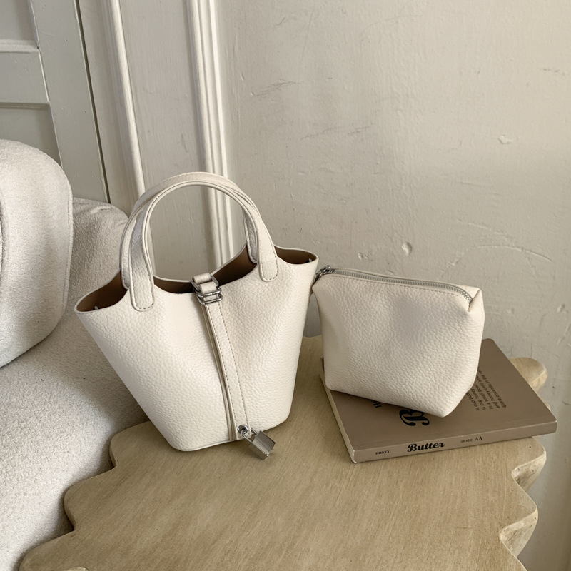 Cestas clásicas de platos bolsas de cubo de mano nicho coreano de litchi de textura alta moda versátil bolso de mochila