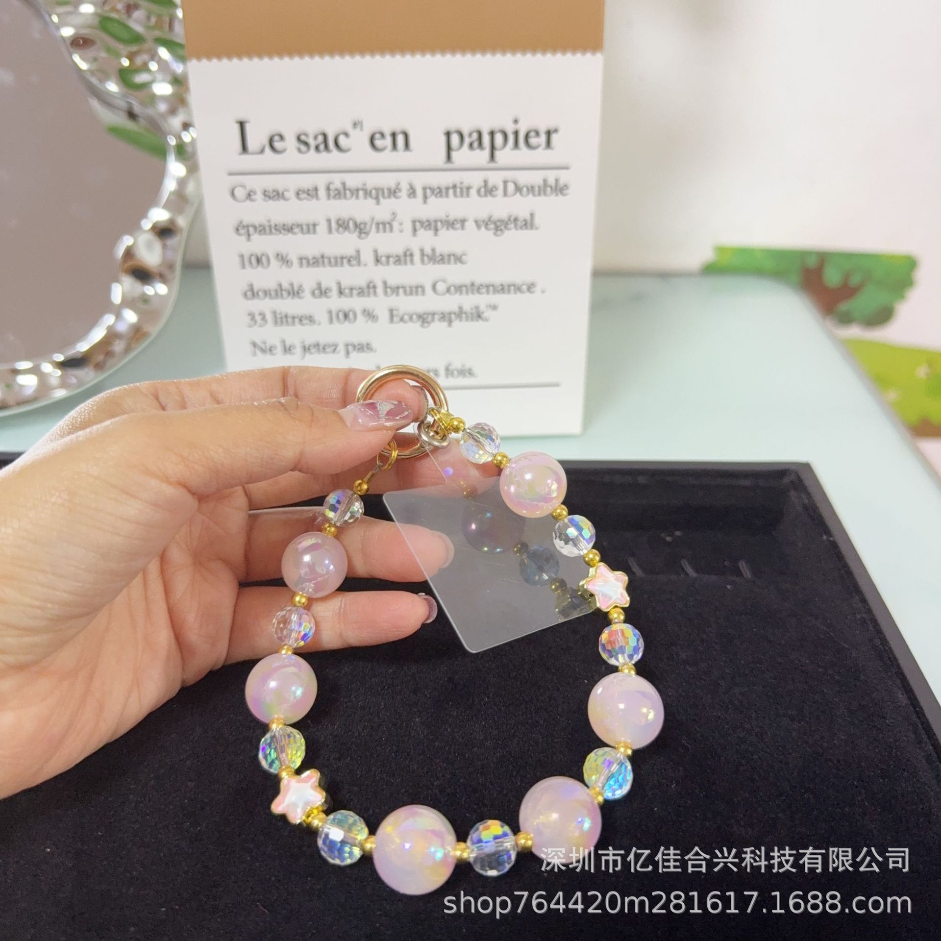 Mayorista cadena de teléfonos móviles sensación de alta calidad estereoscópica bola pentagonal llave colgante perla de teléfono móvil colgante pulsera nuevo