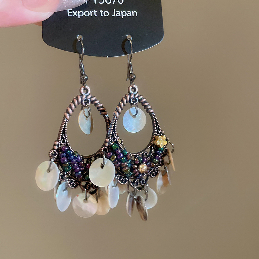 Pendientes de borla de concha geométrica redonda, estilo de vacaciones junto al mar, gancho para la oreja, pendientes de todo fósforo de moda, sentido de clase alta de nicho