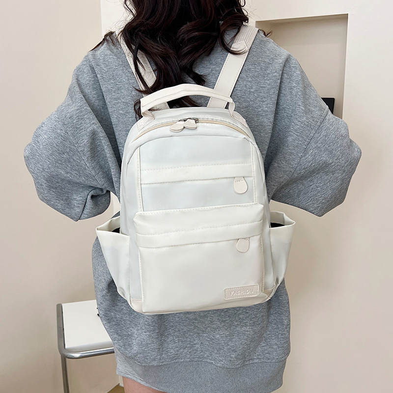 2025 primavera nueva mochila simple de color sólido mochila de estudiantes de escuela primaria mochila de viaje al aire libre