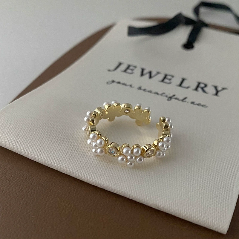 Small design retro universal ring from pearl, flowered, simple and elegant design, on index finger