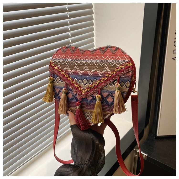 Mayorista bolsos de estilo nacional de mujer 2024 moda nueva mochila en forma de corazón bolsos de hombro bohemios transfronterizos