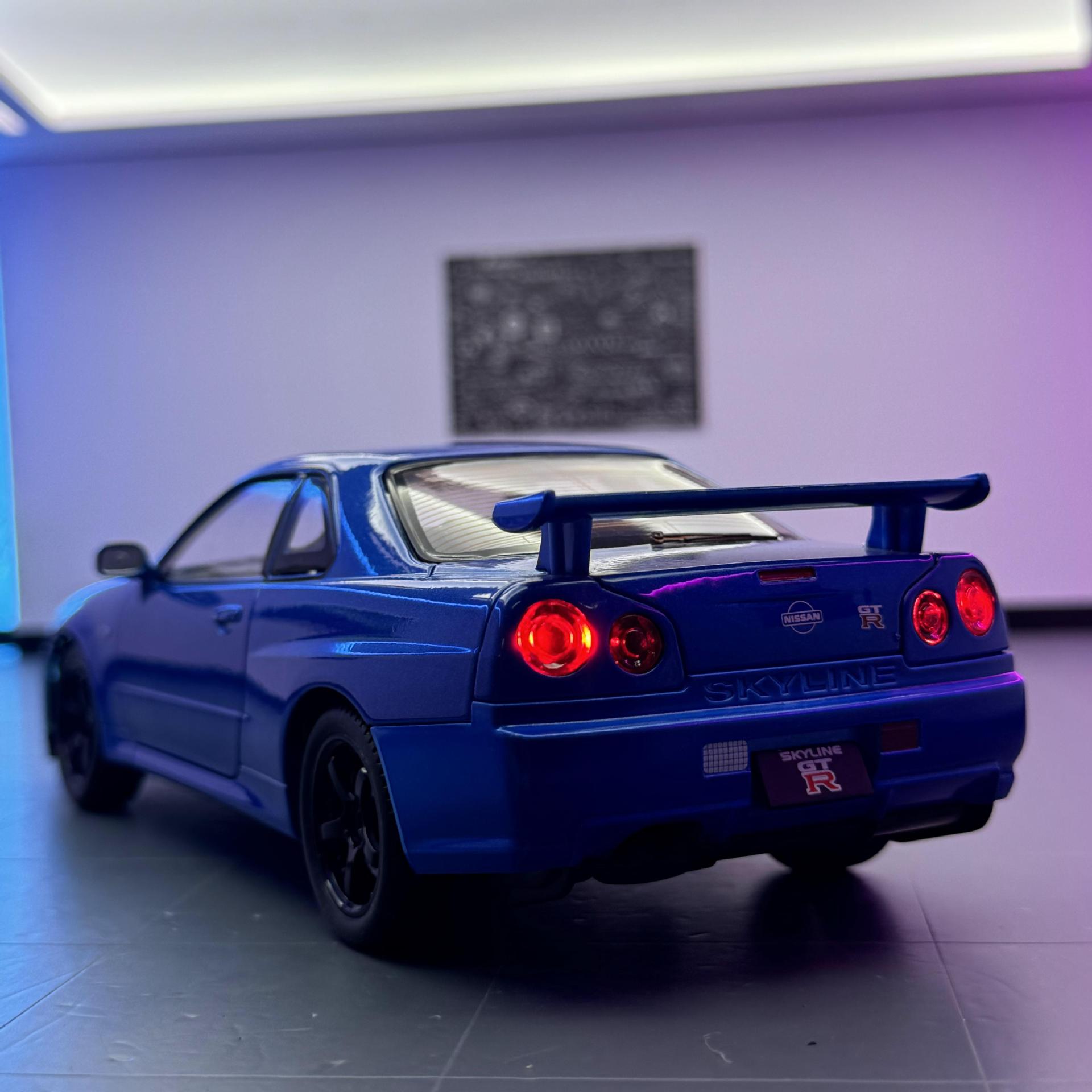 Modelo de coche de aleación Weili 1:24 Nissan GTR coche deportivo retorno luz y sonido coche de juguete modelo R34 decoración al por mayor