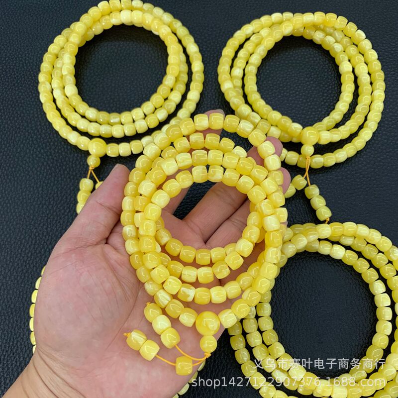 Tiktok live broadcast second generation amber beeswax 108 bracelet fluorescent floating salt water barrel beads beeswax Amber bracelet wholesale