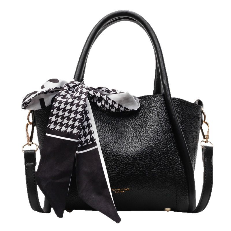 Bolso de cubo con patrón de lichi de alta gama para mujer 2025 nueva tendencia bolso de mensajero de todo fósforo casual bolso de cubo hembra portátil