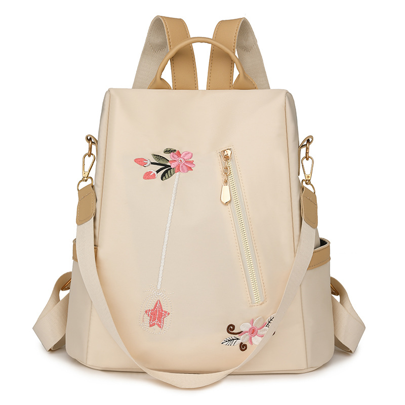 Mochila antirrobo de gran capacidad para mujer con bordado de flores de nuevo estilo Mochila de viaje de ocio de nailon antiagua de moda al por mayor