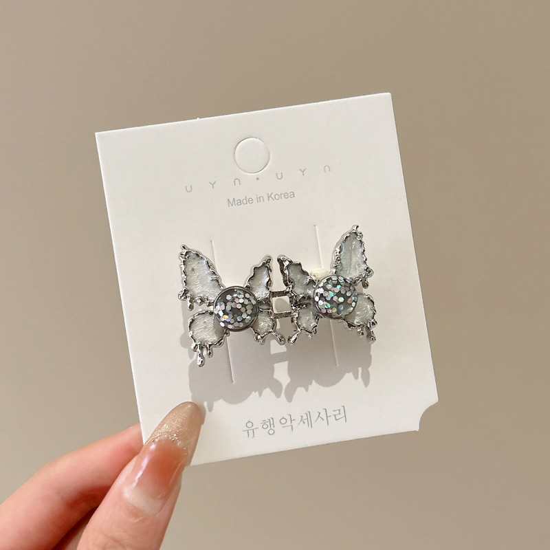 Horquilla de mariposa líquida de estilo dulce, flequillo lateral femenino de alto valor, diseño de nicho, clip lateral suave y versátil, horquilla