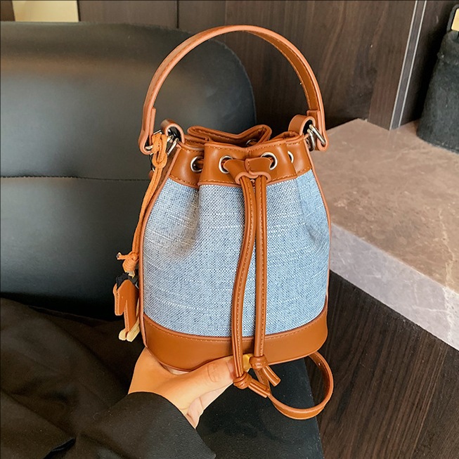 Bolso de cubo de moda transfronteriza 2025 nuevo bolso de hombro de nicho con cordón bolso diagonal bolso de alta gama mujer