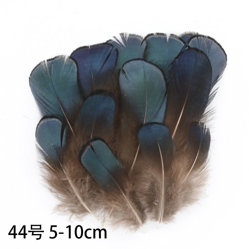 Fábrica al por mayor de bricolaje plumas pequeñas plumas naturales plumas de pollo salvaje plumas de pato jardín de infantes joyas hechas a mano gato divertido material de captura de sueños