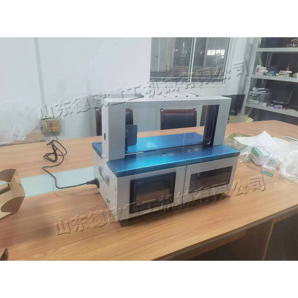 全自动纸箱纸袋捆扎机 台式书籍报刊束带机 小型说明书自动束带机