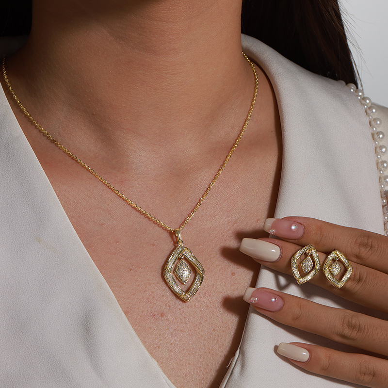 Juego colgante de pendientes de diamante de circonio ligeramente incrustado de aleación Xuping, traje de dos piezas de moda de alta gama de moda europea y americana