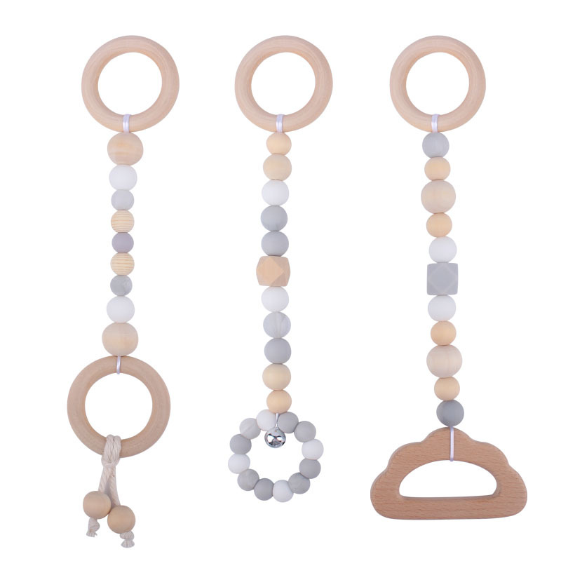 Nuevo Bebé calmante juguetes traje bebé cuentas de silicona haya molares mordedor juguetes pequeña campana Amazon