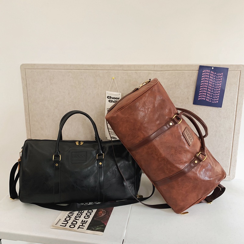 Bolsa de viaje de hombre transfronteriza de estilo europeo y americano, bolsa de maleta de gran capacidad, bolsa de fitness a prueba de salpicaduras.