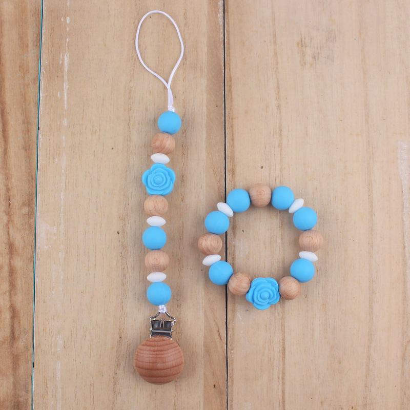 Nuevo bebé de dibujos animados de silicona de doble cara Rosa mordedor calmante bebé anti-gota cadena pulsera traje de juguete