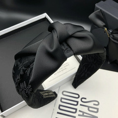 黒い背の高い髪のカチューシャの女性のオリジナルの気質は顔の小さい髪の束の頭の飾りの広い辺の圧力の髪を現して顔のカチューシャを洗います。