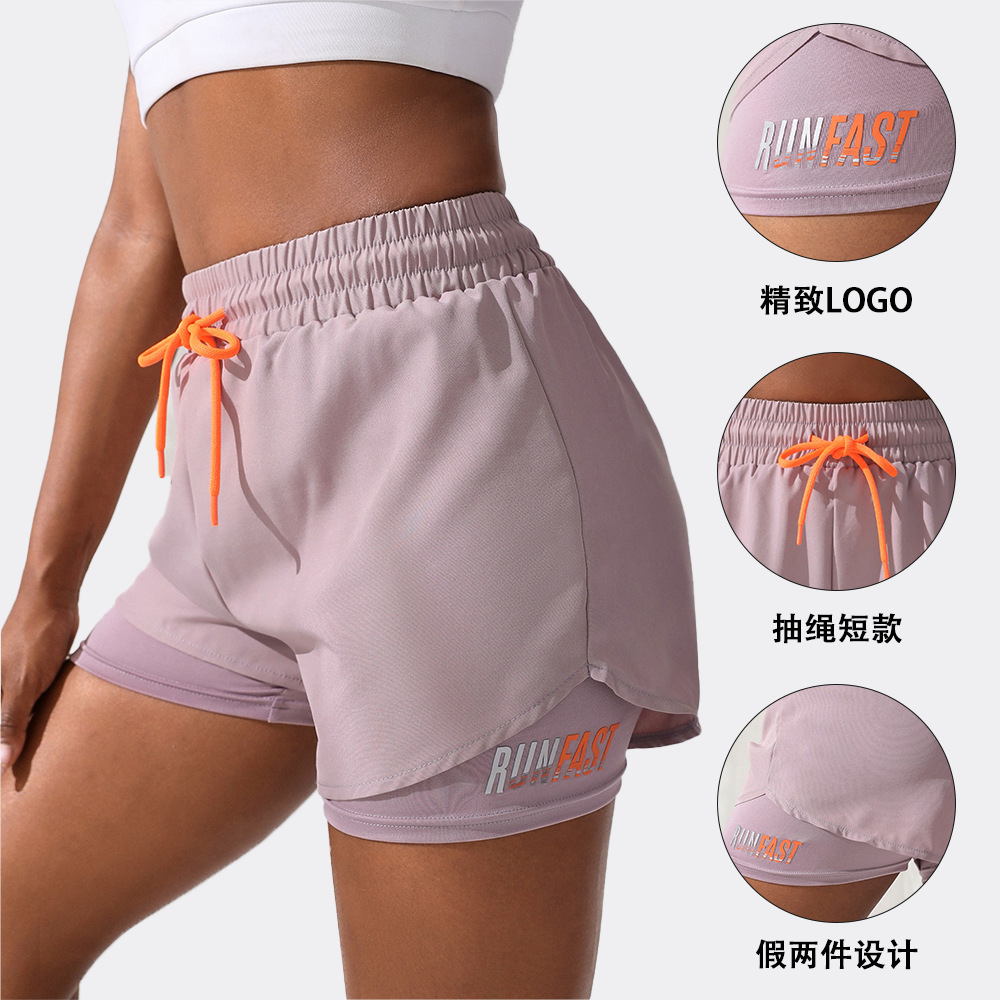 Pantalones cortos con cordón de color de contraste falsos de dos piezas pantalones cortos de tres letras deportivos casuales transpirables anti-exposición de las mujeres pantalones de yoga fitness