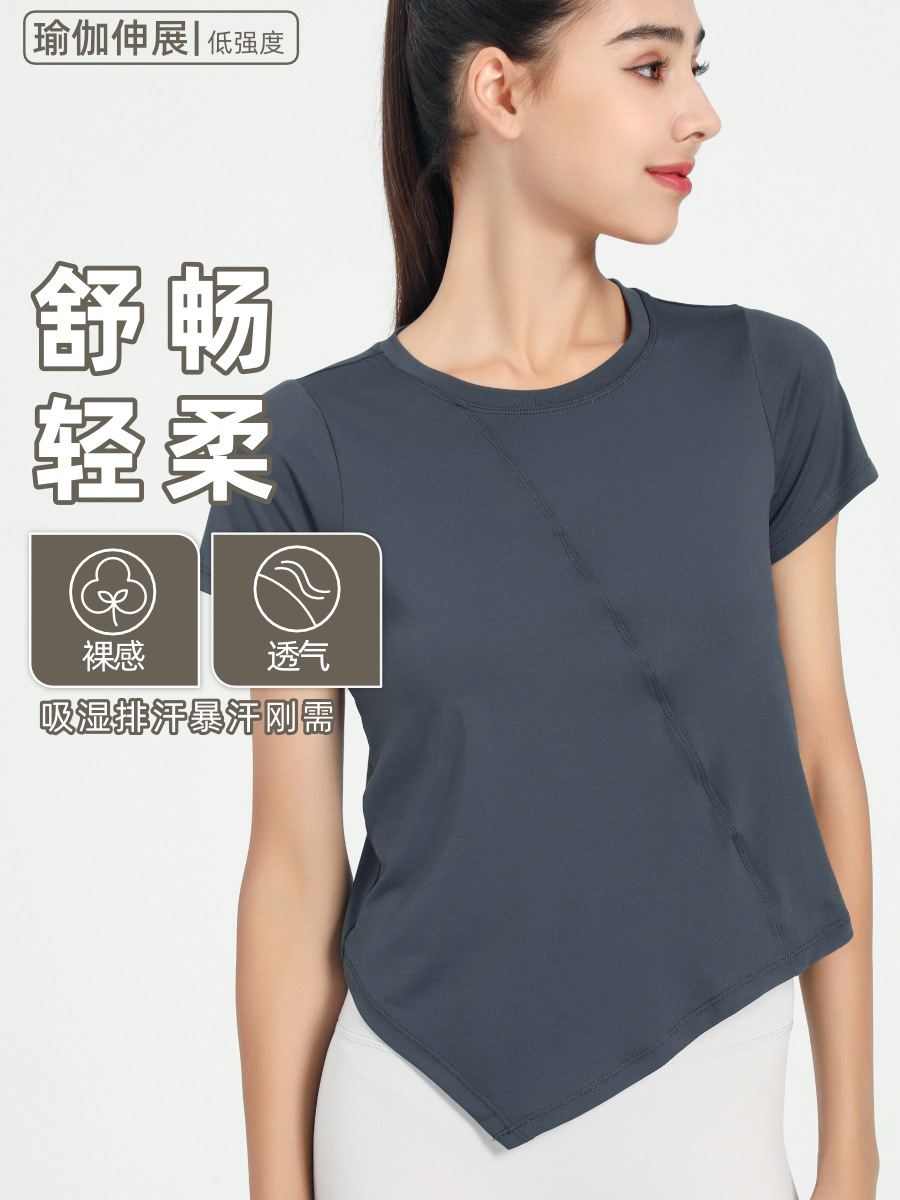 Nuevo verano suelto fitness deportes de manga corta Camiseta de mujer de color sólido europeo y americano de secado rápido irregular yoga Top blusa