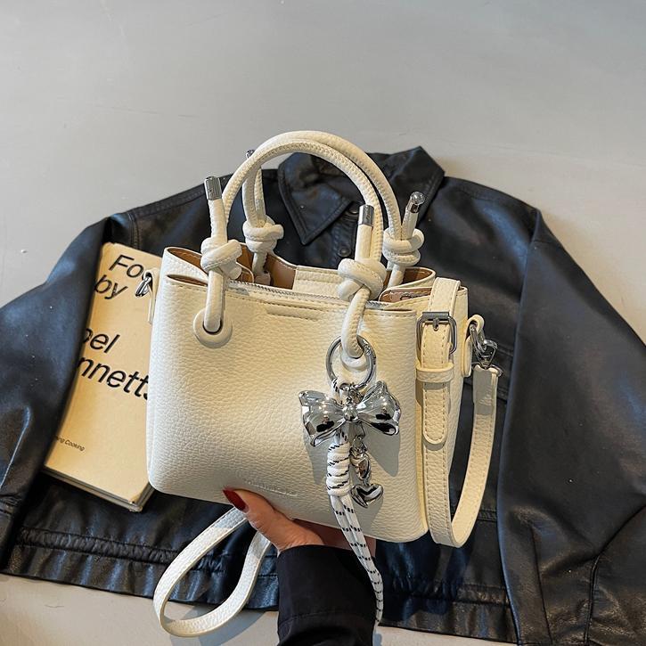 Bolso de mano de estilo explosivo de comercio exterior para mujer 2025 nuevo bolso de hombro casual simple bolso de cubo de sentido avanzado de moda salvaje