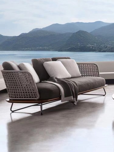 Nordic outdoor sofa and lounge balcony rattan chair and coffee table set of three, designer homestay courtyard hotel villa