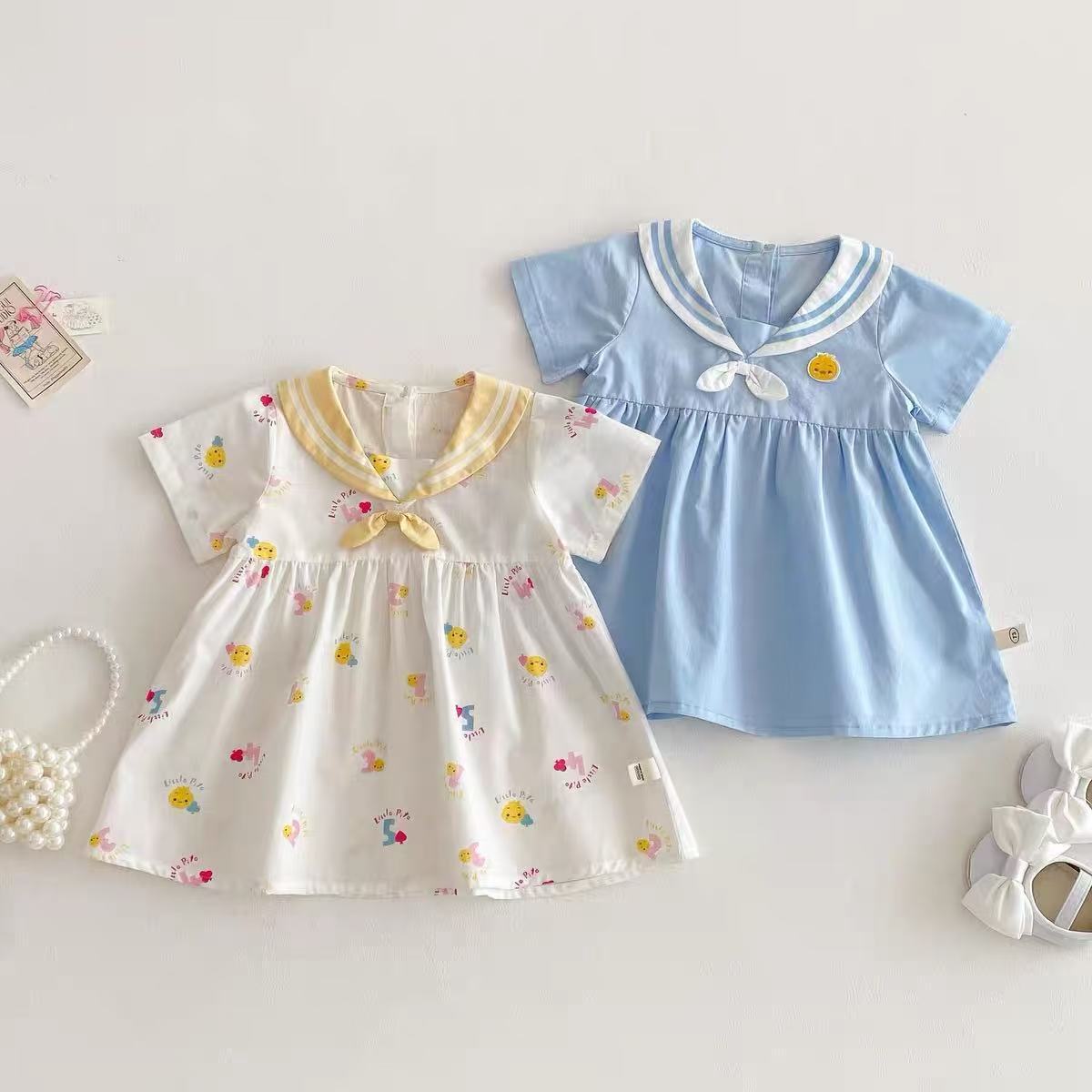 Vestido súper lindo para niñas nuevo verano bebé lindo vestido de manga corta de dibujos animados de verano azul marino