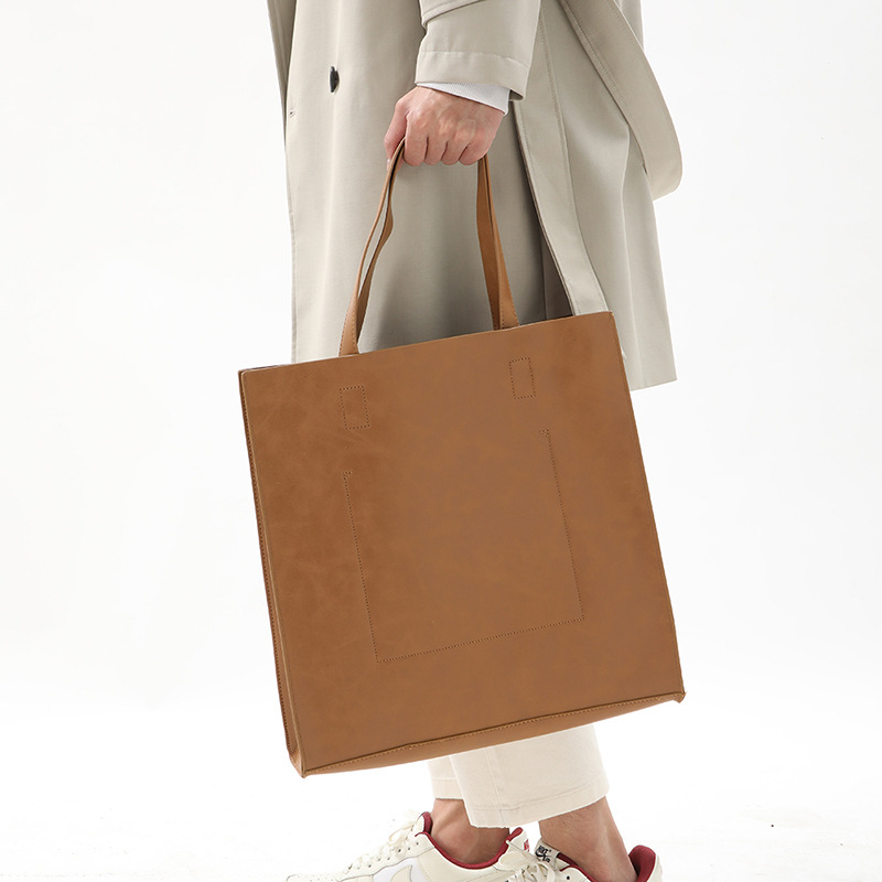 Korean version of fashionable PU leather shoulder bag, simple commuter men's and women's tote bag, square vertical crossbody large-capacity handbag_voghion.com