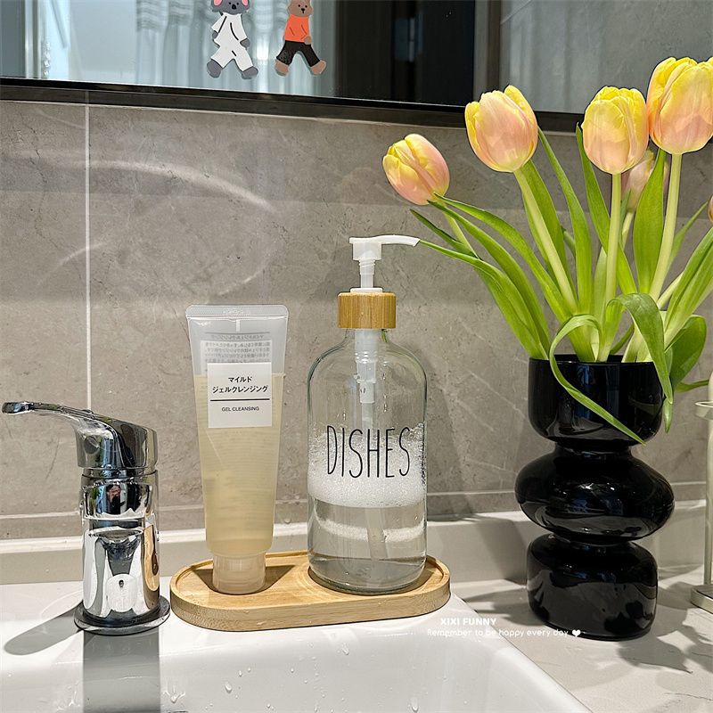 Gran volumen de vidrio nórdico envasado botellas vacías de baño desinfectante de manos gel de baño champú de presión en el lavabo de aire