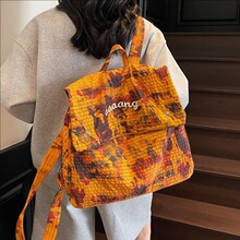 2025新款潮流水染布迷彩大容量双肩包女轻便外出字母旅游双肩背包