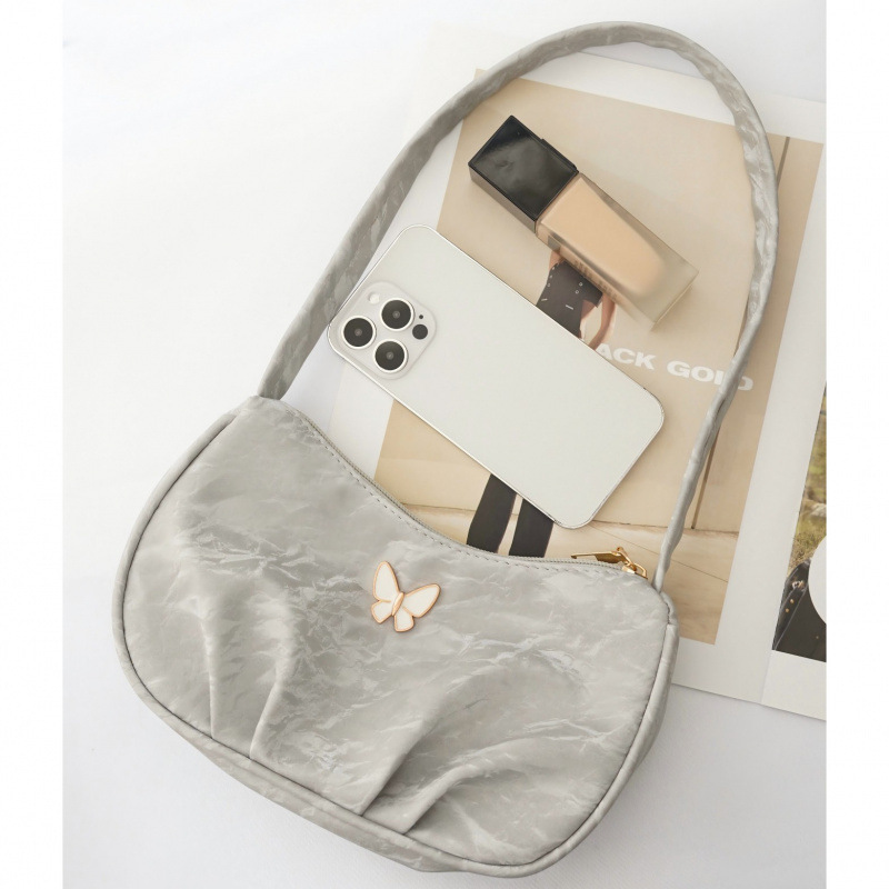 Bolsa de mariposa para mujeres 2025 verano nuevo estilo diario simple con casualidad de color sólido de hombro plegado en la parte inferior de la camisa