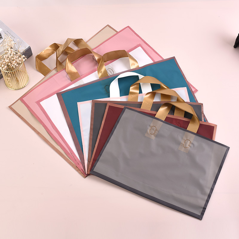 现货金边磨砂塑料手提袋女装广告服装店购物袋礼品包装袋印刷logo