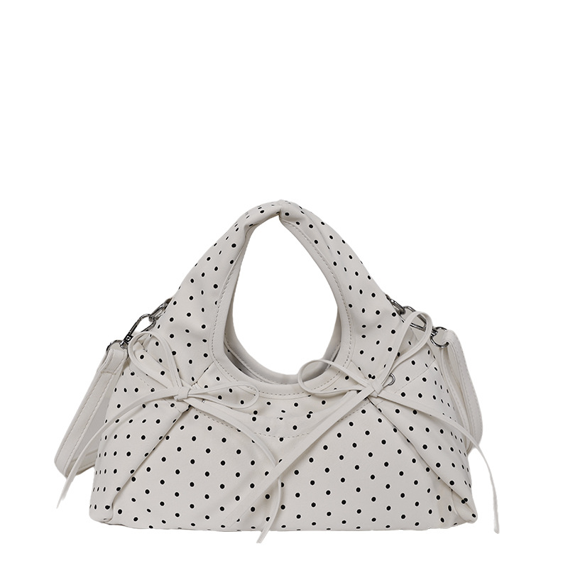 Bolsa de mano de arco exquisita coreana para mujeres verano 2026 simple diaria versátil onda punto sensación de hombro mochila