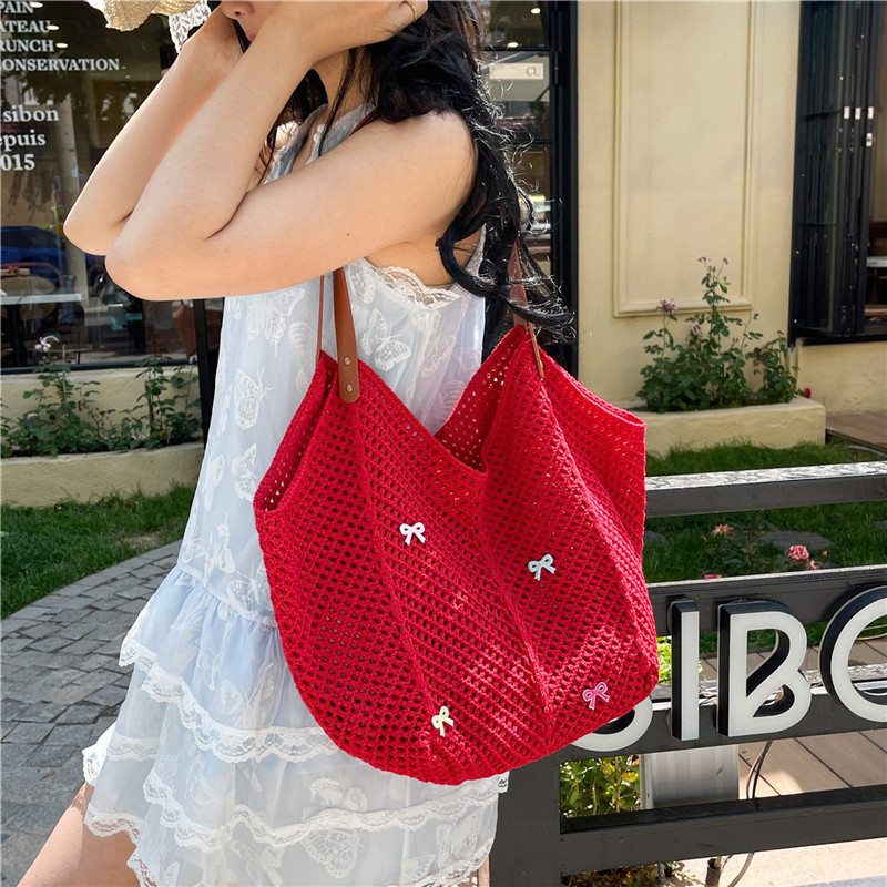 Viaje junto al mar estilo vacaciones bolso de playa tejido hueco mujer 2025 verano nuevo bolso tejido de paja bolso de alta capacidad