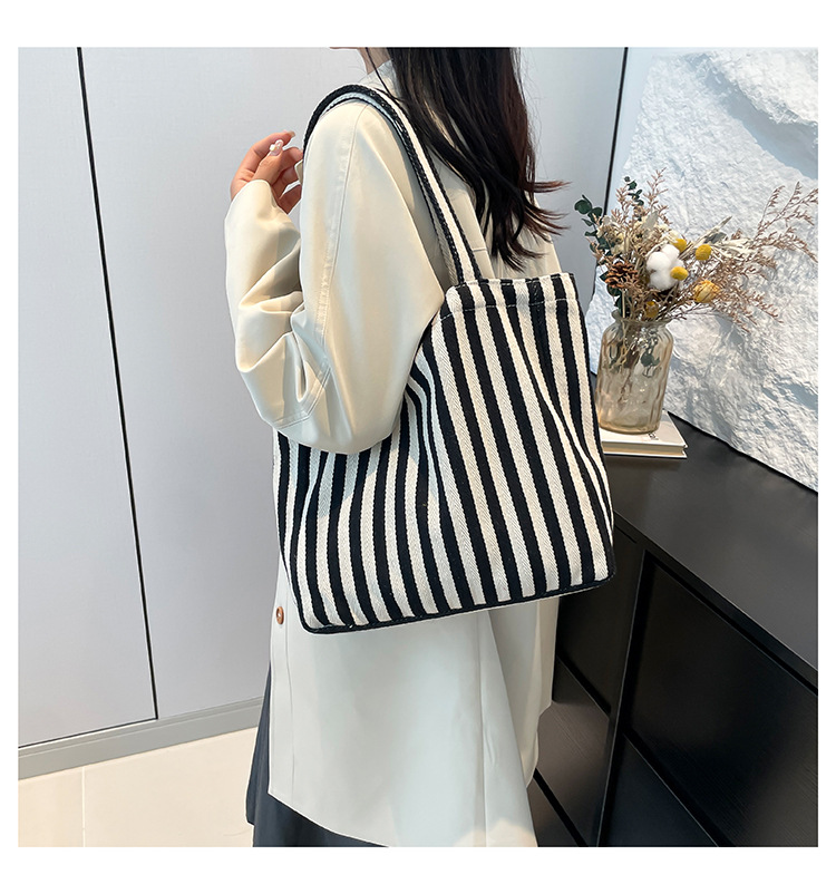 2024 Autumn/Winter new versatile and fashionable striped handbag shopping bag, two-tone large-capacity trendy single-shoulder bag undefined
