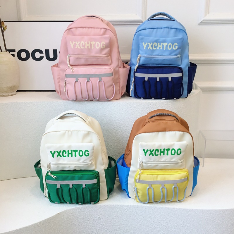 Mochila escolar coreana para niños y estudiantes con letras de color contrastante personales para reducir la carga de la mochila de jardín de infantes de gran capacidad