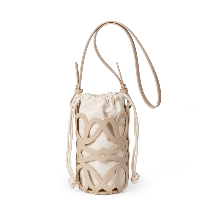 Bolso de mujer 2022 nuevo diseño de nicho hueco cordón lienzo cilindro pequeño bolso personalizado retro crossbody bolso de hombro