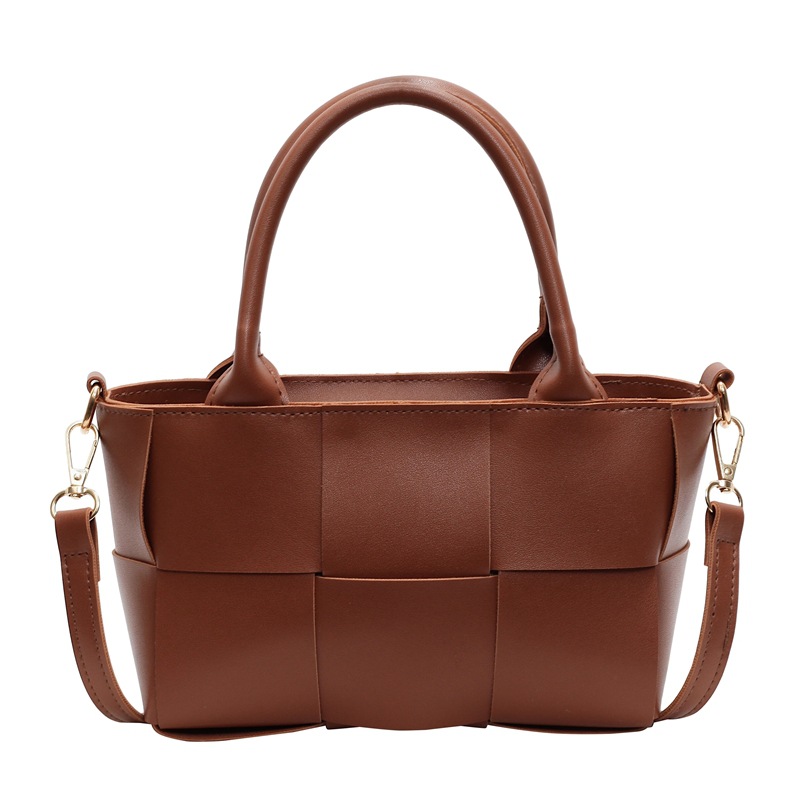 Diseño coreano de nicho de alta sensación portátil bolso de cubo de moda para mujeres 2024 nuevo tejido retro hombro mochila