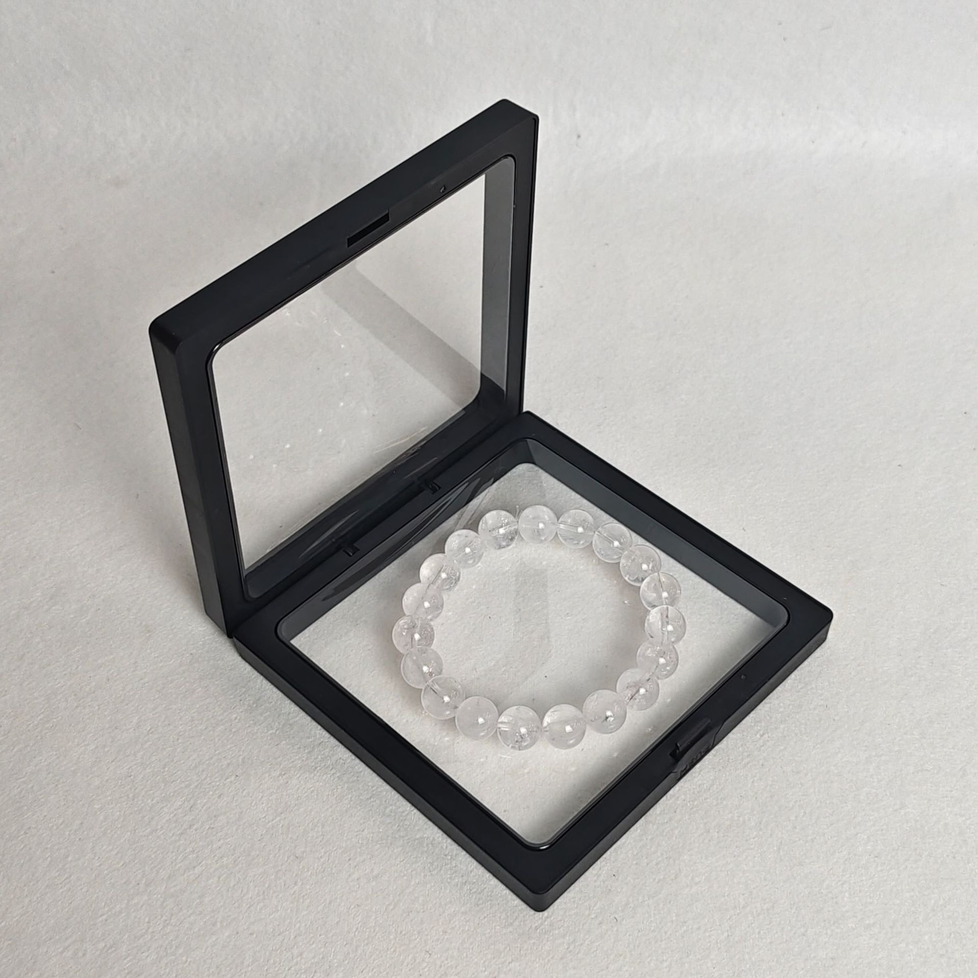 Black pe film box; length and width 9*9cm, thickness 2cm