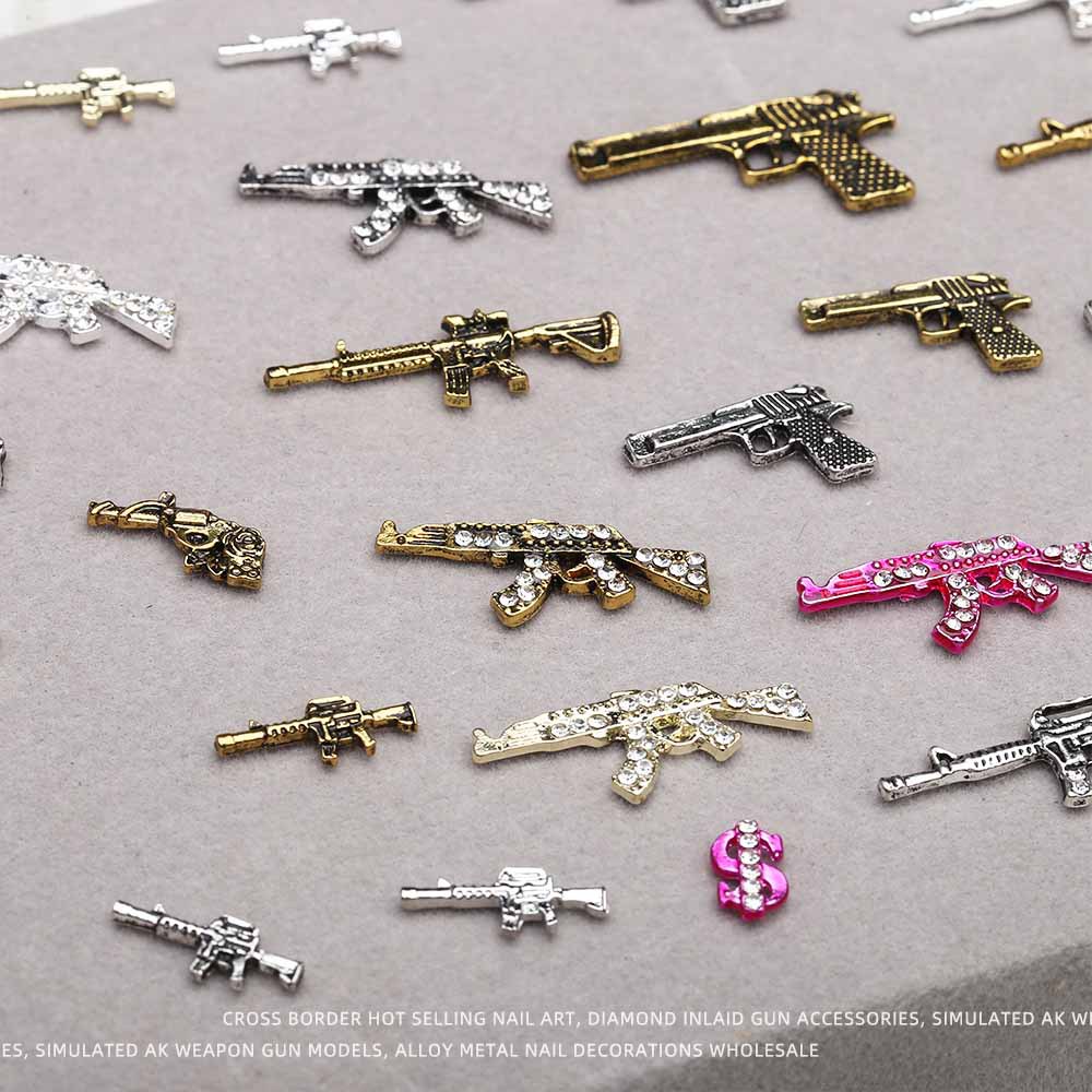 Europa y los Estados Unidos en línea con diamantes AK armas de manicuría joyas de simulación de personalidad tridimensional armas de fuego decoración de uñas al por mayor